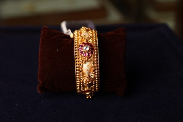 ANTIQUE FINISH SEMI RUBY STONE FITTED BANGLE WITH WHITE BEEDS AND MINAKARI WORK DONE
