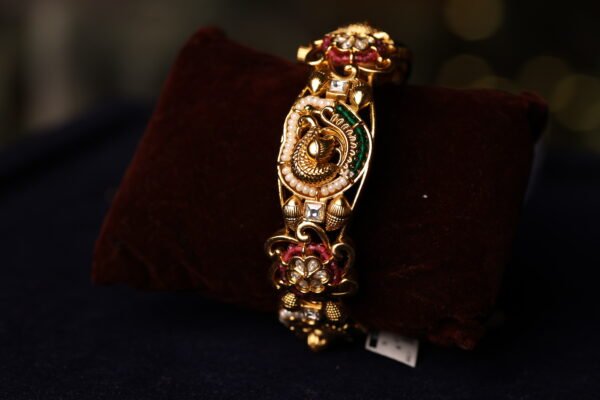 ANTIQUE FINISH SEMI WHITE STONE FITTED BANGLE WITH WHITE & GREEN BEEDS AND MINAKARI WORK DONE