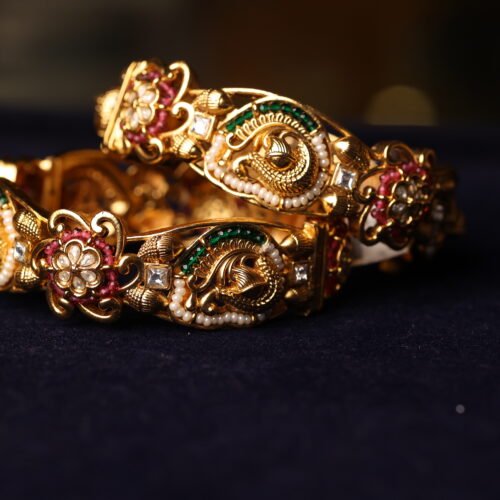 ANTIQUE FINISH SEMI WHITE STONE FITTED BANGLE WITH WHITE & GREEN BEEDS AND MINAKARI WORK DONE