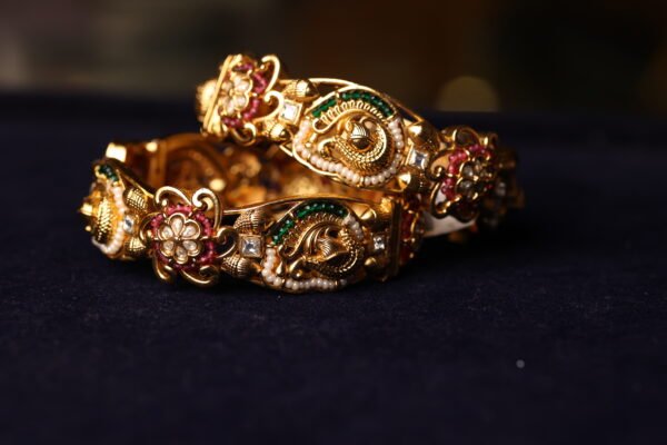 ANTIQUE FINISH SEMI WHITE STONE FITTED BANGLE WITH WHITE & GREEN BEEDS AND MINAKARI WORK DONE