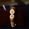 ANTIQUE FINISH SEMI RUBY STONE FITTED BANGLE WITH WHITE BEEDS AND MINAKARI WORK DONE